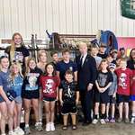 image for Biden poses with kids wearing Trump T-shirts in Pennsylvania