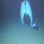 image for The first photo taken of the Titan submersible on the ocean floor, after the implosion.