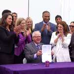 image for Tim Walz after dedicating a highway to Prince using purple ink