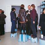 image for Same-height party where guests wore shoe-extenders to make them all 2-meters tall