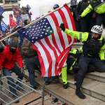 image for Capitol police being attacked with American flag pole on Jan 6.