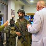 image for Soldiers shutting down the Aljazeera office.