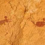 image for 9,000 year old cave painting in the middle of the Sahara Desert show’s people swimming.