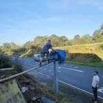 image for Brave man helps to shield speed camera from the blazing hot sun. Not all heroes wear capes.