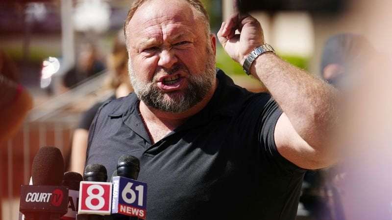 image for Alex Jones’ conspiracy theory empire Infowars will be sold for parts to help pay Sandy Hook families