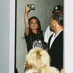 image for Lindsay Lohan taking photos of the paparazzi with a disposable camera, 2004