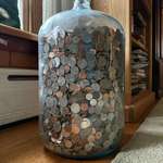 image for My Grandpa saved his change in this glass jug for 70 years, and is finally letting me count it!
