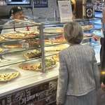 image for Tim Walz ordering a pizza with his wife after the debate in New York City