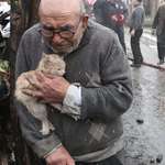 image for An 83-year-old man from Turkey, hugging his kitten during his house fire