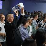 image for Former President Donald Trump tossing paper towels into a crowd in Puerto Rico after Hurricane Maria