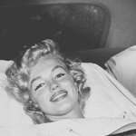 image for Marilyn Monroe smiling for the cameras after almost dying due to an ectopic pregnancy