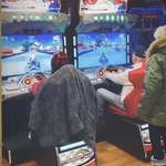 image for President Biden playing Mario Kart with his granddaughter, Naomi.