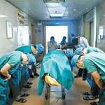 image for Chinese doctors bow to 11-year old boy with brain cancer who saved many lives by donating his organs