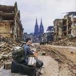 image for A woman with her possessions in the ruins of Cologne, Germany 1945