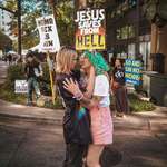 image for My girlfriend and I kissing in front of hate preachers at South Carolina Pride