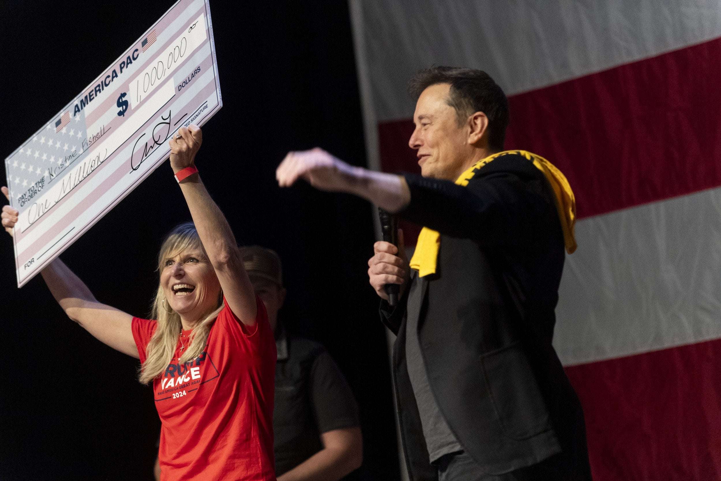 image for Elon Musk Defies DOJ As He Hands Out Another $2M to Swing State Voters