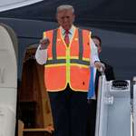 image for Trump emerging from his plane cosplaying as a garbage man