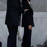 image for Kamala Harris with her husband Doug Emhoff after delivering a campaign speech at the Ellipse