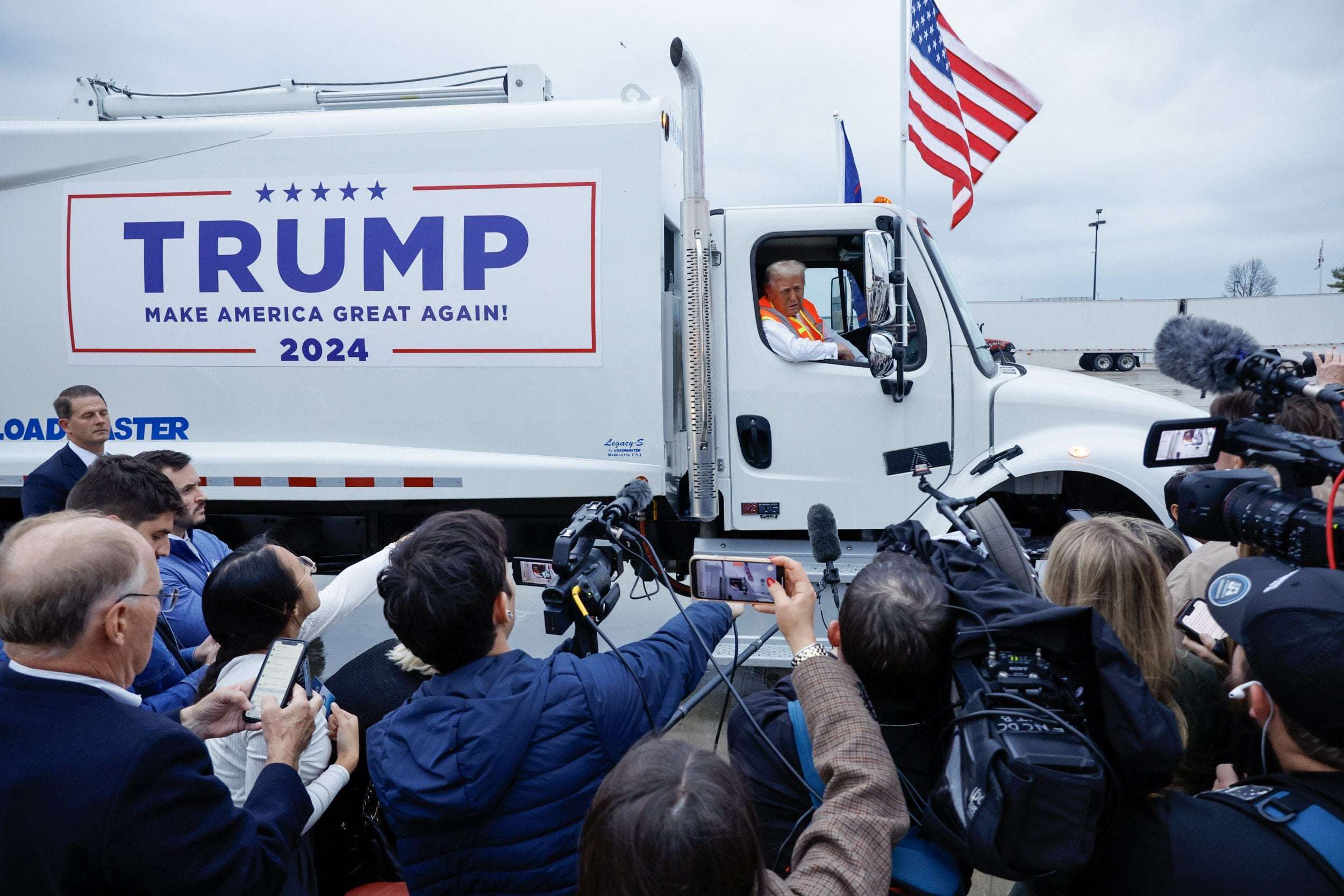 image for Video of Donald Trump 'Struggling' to Enter Garbage Truck Goes Viral