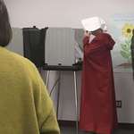 image for Woman dressed as 'Handmaid' votes in Asheville, North Carolina
