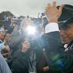image for Senator Barack Obama wears a cowboy hat at a 2007 campaign rally in Texas