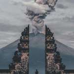 image for A temple caretaker watching a volcano eruption in Bali