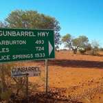 image for A road sign in the Outback where outer space is 5 x nearer than the closest town, water or fuel.