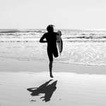 image for Aussie surfer Kai Mackenzie at the same beach where his leg was bitten off only 12 weeks ago.