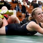 image for State champion wrestler Makynlee Cova posing for camera as she chokes her rival during the fight.