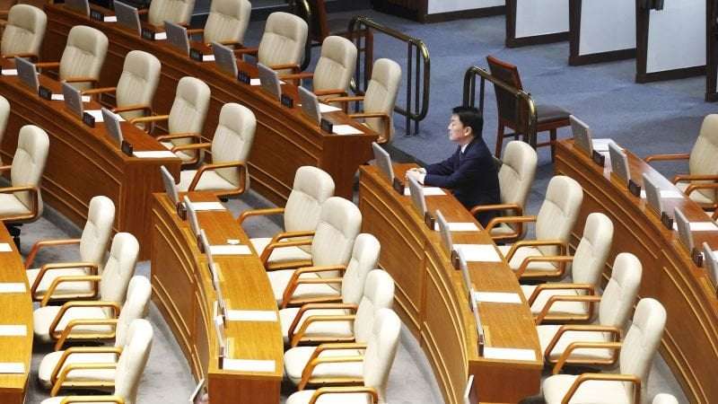 image for South Korea president survives impeachment after governing lawmakers boycott vote