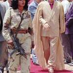 image for Muammar Gaddafi with one of his lady bodyguards. In Cairo 1994 👀