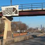 image for Deny Defend Depose banner hanging over Lake Shore Drive in Chicago earlier this week
