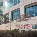 image for “Deny, Depose, Defend” was spray painted on the UnitedHealthcare office building in Las Vegas