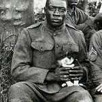 image for A Harlem Hellfighter who rescued a Puppy during World War 1 poses for the camera, 1918