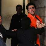 image for Luigi Mangione being escorted into a Pennsylvania court house