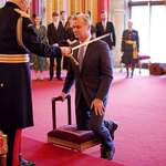 image for Sir Christopher Nolan accepts his knighthood from the king