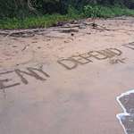 image for Some guy casually wrote "Deny, Defend, Depose" in the sand and kept walking (Costa Rica)
