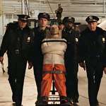 image for Hannibal Lector being transported to meet Sen. Ruth Martin. He killed 45 people