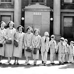 image for A married couple with their 11 children on Palm Sunday, 1954.