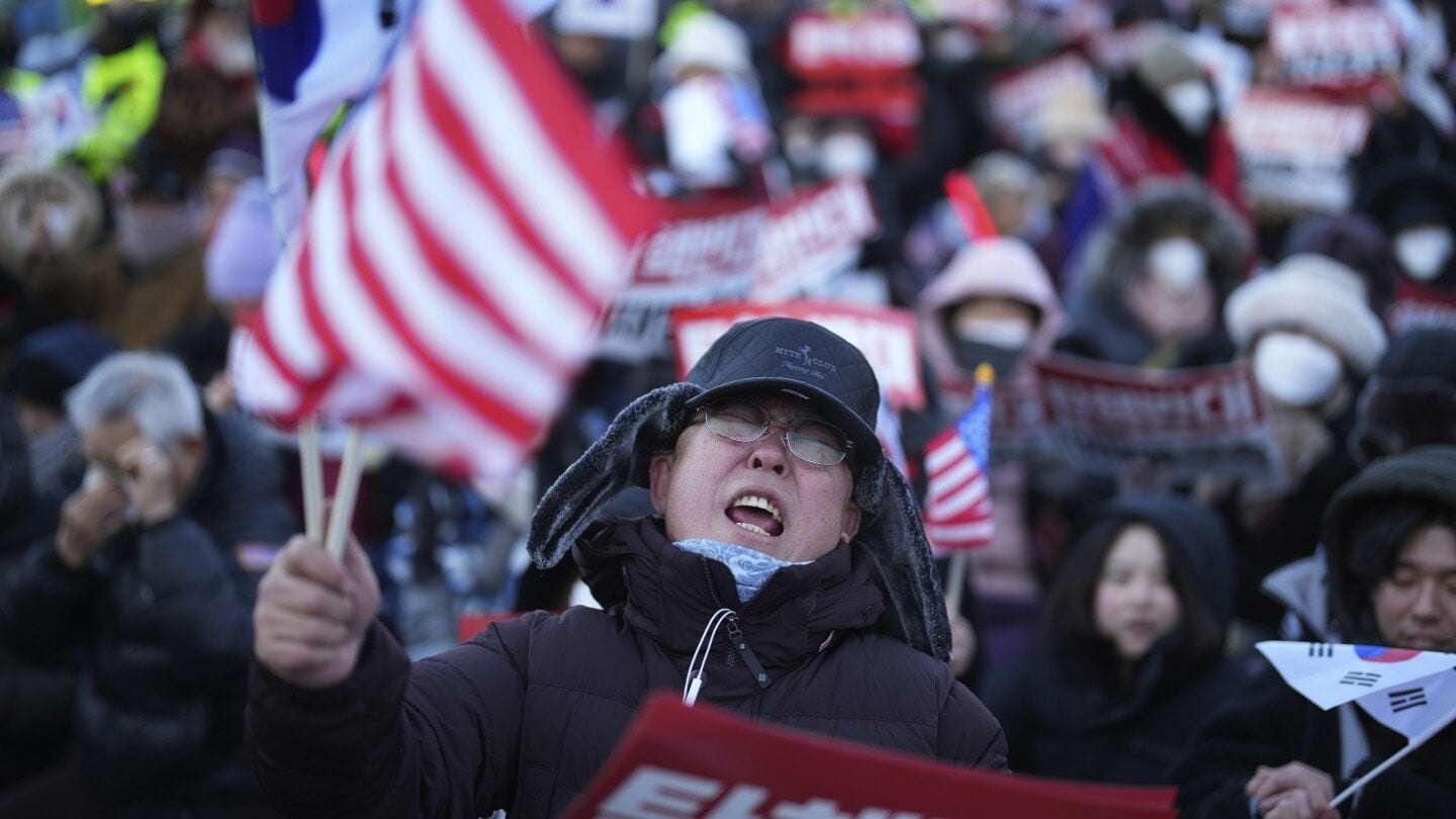 image for South Korea’s impeached president defies warrant after hourslong standoff
