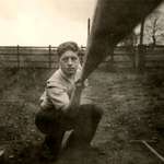 image for A man takes a selfie using a stick of wood to activate the camera, 1957