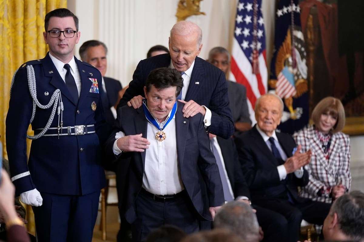 image for Biden awards Medal of Freedom to 19, including Hillary Clinton, Bono and Michael J Fox