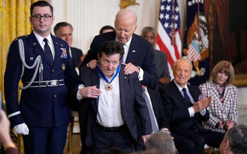 image for Biden awards Medal of Freedom to 19, including Hillary Clinton, Bono and Michael J Fox