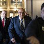 image for Rudy Giuliani leaving court after being found in contempt.