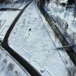 image for Lady in my city makes snow art