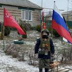 image for Russian Child in military uniform praising strongman dictator. MAGA wants this for us