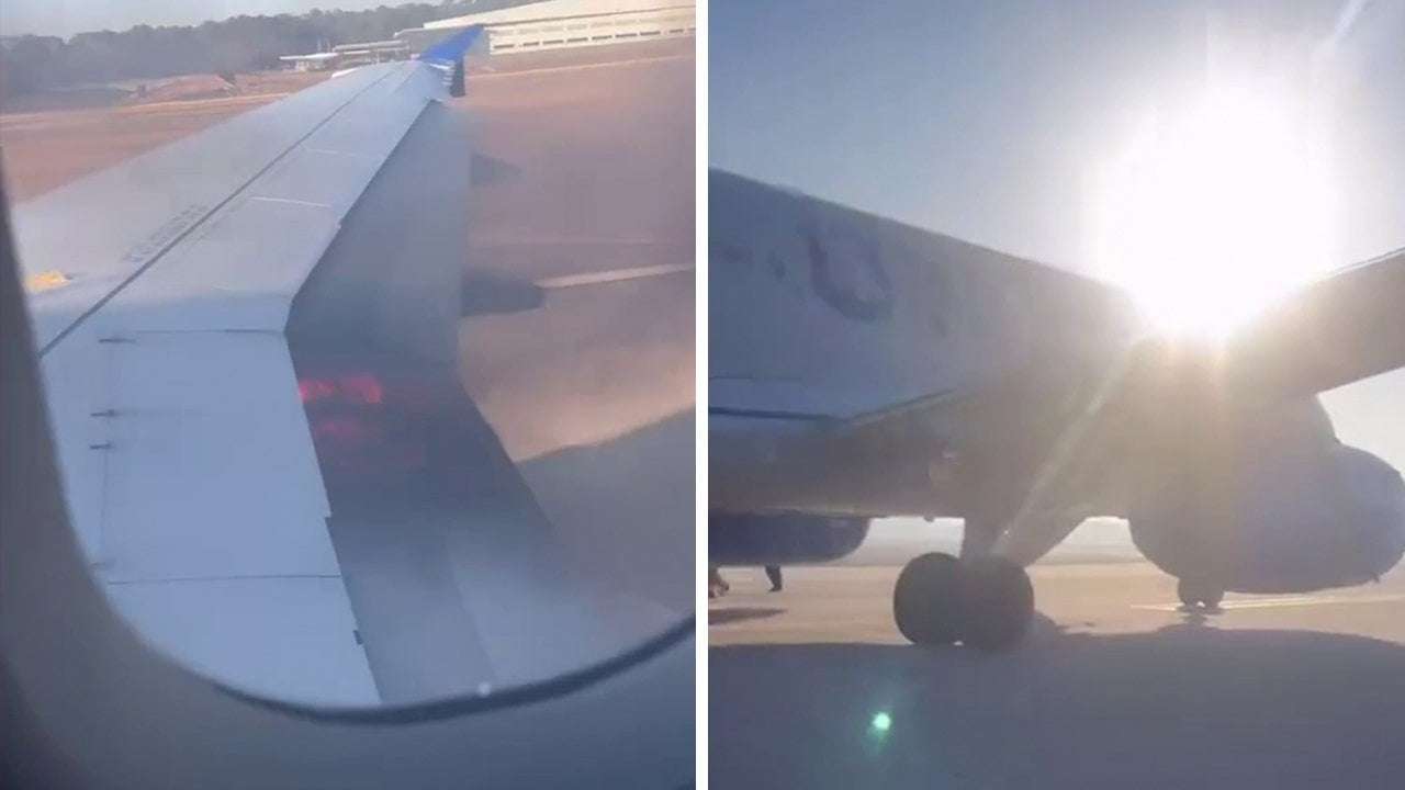 image for United Airlines plane catches fire at Houston's Bush Airport