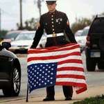 image for US Marine displays flag upside down as sign of distress