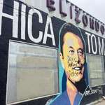 image for “Deny, Defend, Depose” written on Elon mural in Texas