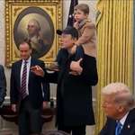 image for Leader of the free world uses human shield while answering questions to the press.